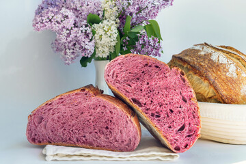 Homemade Artisan Purple Bread Sourdough Made from Purple Sweet Potato. with natural color. Purple tartine cut into slices.