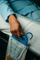man in bed wearing a urinary catheterization