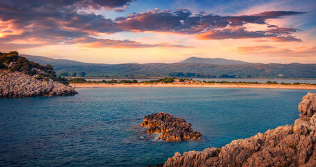 Sunset on rocky coast of Voidokilia Beach. Impressive summer seascpae of Ionian sea, Pilos town...
