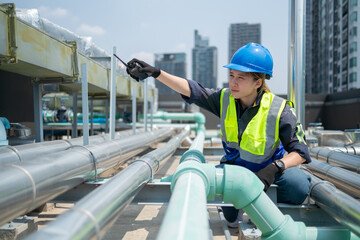 Engineer under industrial inspection Large water heaters are used in high-rise condominiums.