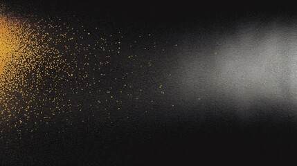 Obraz premium Gold and Silver Particle Spray on a Black Background