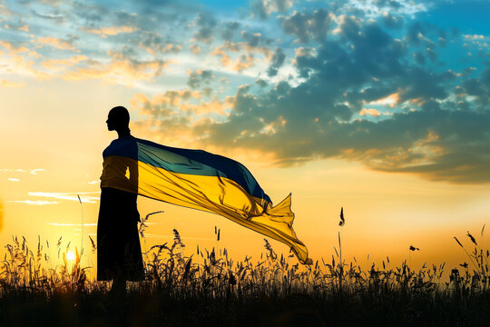 Silhouette of a woman with waving flag of Ukraine