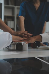 Doctor handshake and partnership in healthcare, medicine or trust for collaboration, unity or support.Team of medical experts shaking hands in teamwork for or success in hospital