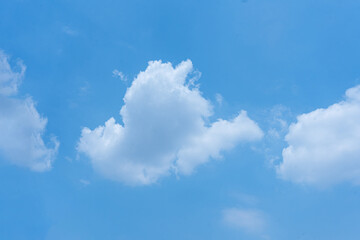 Blue Sky with Fluffy Clouds on a Summer Day