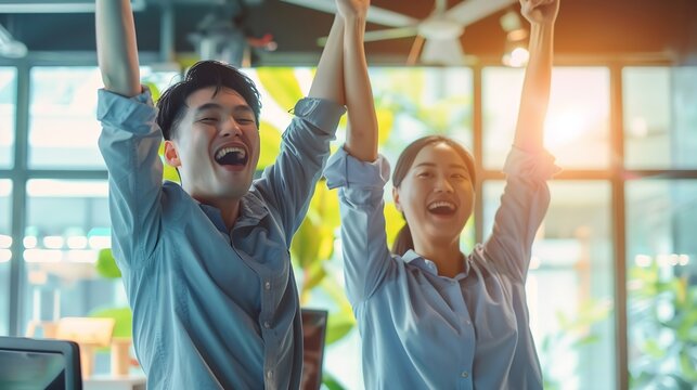 Young happy Asian business man woman work together celebrate success in start up office Creative team brainstorm meeting businesspeople colleague partnership or office coworker teamwor : Generative AI