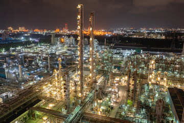 Fototapeta premium Petroleum chemical factory illuminated at night