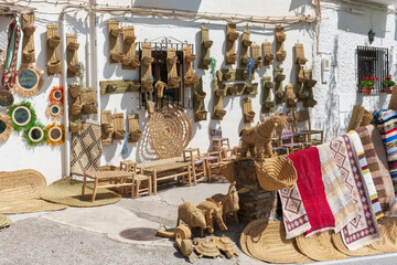 Small traditional business in a white Andalusian village selling handmade esparto grass products.