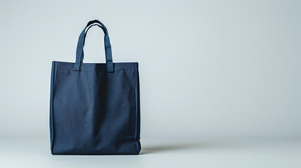 Eco-Friendly Dark Blue Reusable Fabric Tote Bag Minimalist Design on Soft Gray Background