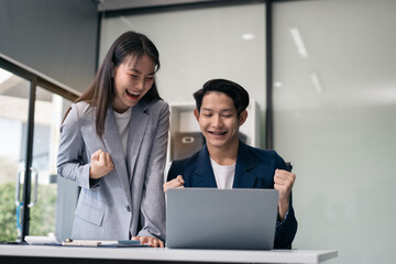 Business team of businessmen creative businesspeople coworker in office Happy to be successful partnership teamwork success concept.