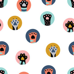 Colored cat paws . Polka dot. Vector illustration.Seamless pattern.