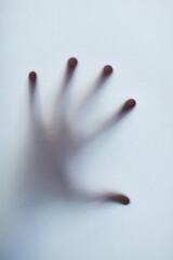 Hand, print and glass for scary ghost, silhouette and nightmare impression or shadow in fog....