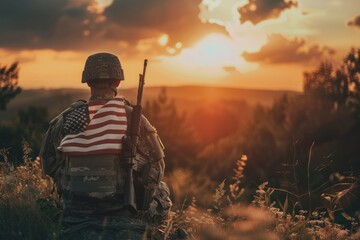 Soldier in uniform sitting at sunset with American flag draped over shoulders. Patriotic military concept. Memorial Day or Veterans Day tribute.