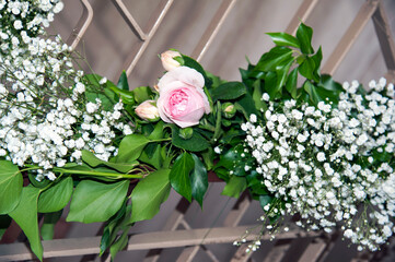 Fresh flowers and branches to ornate the stairway for the event.