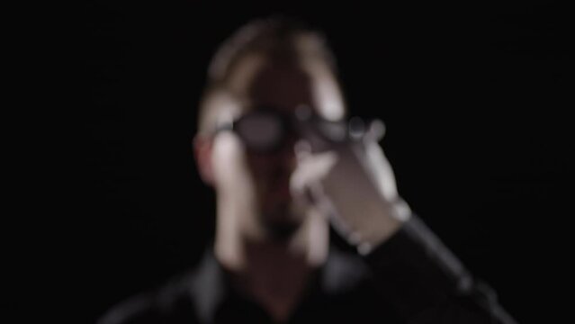 Villain turn on glowing eyeglasses and show the middle finger 4K
