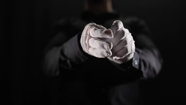 Headless person remove and drop white gloves 4K