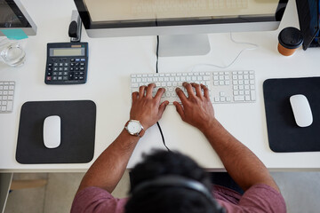 Call center, typing and man with headset in office for communication, customer support or CRM....