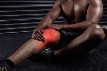 Fitness, gym and man with knee injury, accident or medical emergency for pain in training. Red...