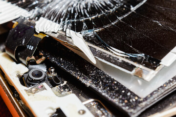 Broken smart phone closeup, macro shot.
