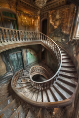 Fototapeta premium Ornate Spiral Staircase in Abandoned Mansion - Liminal Image
