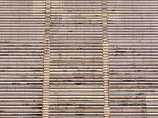 Aerial image of an empty concrete stadium with bench seating.
