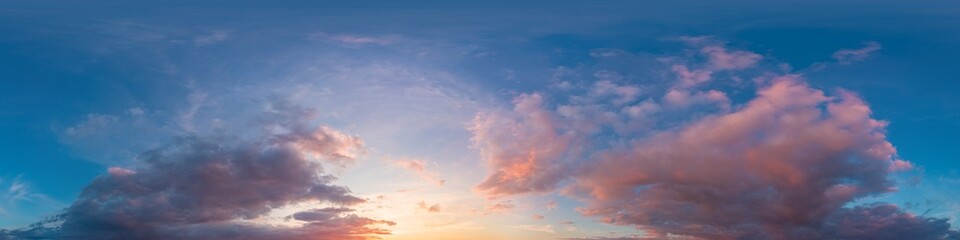 Dramatic Sunset sky 360 panorama. Vibrant sky panorama with bright glowing red pink Cumulus clouds. HDR 360 seamless spherical panorama. Sky dome for aerial drone panoramas. Climate and weather change