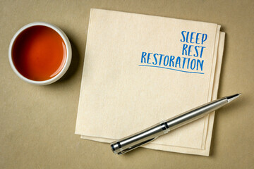 sleep, rest, restoration - inspirational words on a napkin with tea, slef care and lifestyle concept
