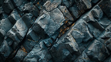 Detailed blue rock formations with golden accents create an abstract and textured background, ideal...