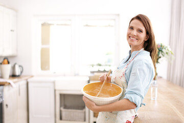 Woman, portrait and baking by mixing batter in kitchen with ingredients as baker for dessert...