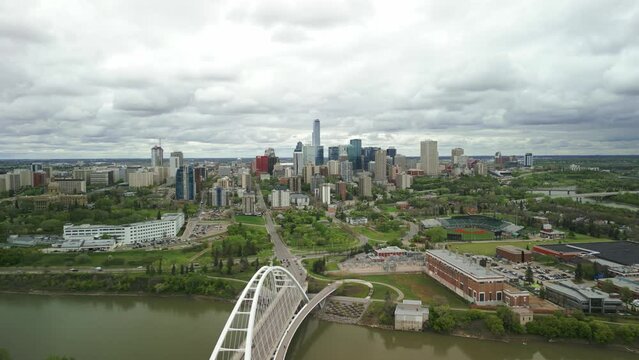 Edmonton downtown skyline with perspective over the Queen Elizabeth II Park, with the Walterdale Bridge featured. The vibrant cityscape, nestled along the North Saskatchewan River.