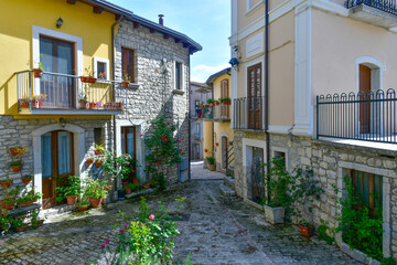 Fototapeta premium A narrow street with old houses in Pietrelcina, a medieval town in Campania, Italy.
