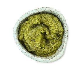 Fresh tasty pesto sauce isolated on white, top view