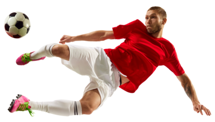 Portrait of young Caucasian soccer football player looks confident practicing kicking ball in motion against transparent background. Concept of game, sport, recreation, active lifestyle.