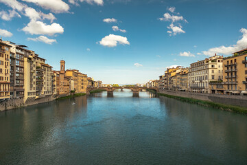 Fototapeta premium View on Ponte Santa Trinita Bridge in Florence during sunrise in the summertime with copy space