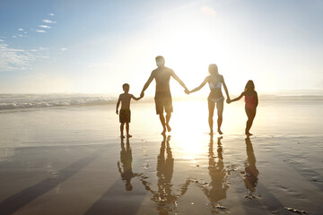 Holding hands, summer and sunset with family on beach, walking together for bonding on holiday....