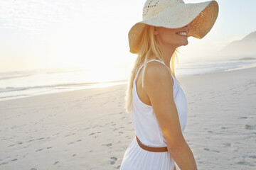 Wellness, sunset and woman on beach with hat for summer vacation, fresh air and tropical...