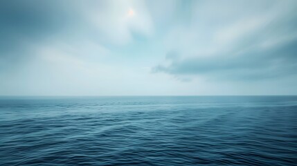 Obraz premium Hazy sky and tranquil ocean horizon create a sense of serenity and escape.