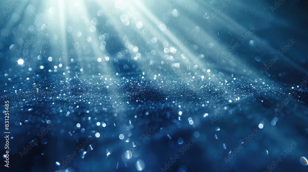 Poster delicate light rays with blue glitter particles gracefully falling in a loop, creating a mesmerizing