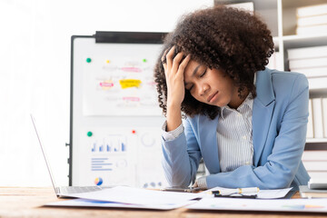 Tired businesswoman with headache at office feeling sick at work action Work too hard and too late,...