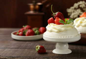 Meringue pavlova cake with berries and butter cream