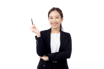 A cheerful young asian businesswoman in a suit, smiling and looking up, holding a pen, celebrating...