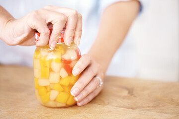 Kitchen, fruit and hands with jar of peach, smile and organic for nutritionist, healthy and house....