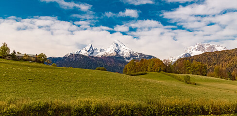 Fototapeta premium Alpine spring view with Mount Watzmann and Mount Hochkalter in the background near Bischofswiesen, Berchtesgadener Land, Bavaria, Germany