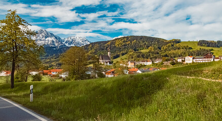 Alpine spring view with a church in the background near Anger, Berchtesgadener Land, Bavaria, Germany