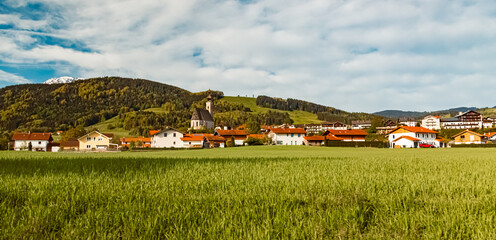 Alpine spring view with a church in the background near Anger, Berchtesgadener Land, Bavaria,...