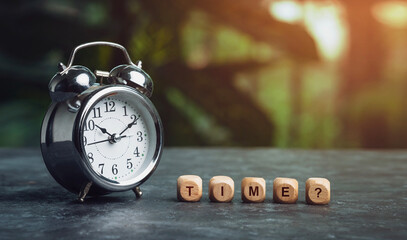 Time finance and lifestyle concept image, Alarm clock on the table with wooden dice and e commerce icon on it