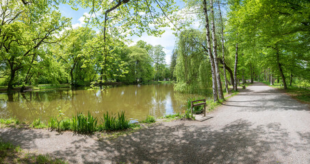 walkway around idyllic pond, Irlacher Weiher, spa garden Bad Aibling at springtime. tourist desitnation  bavaria