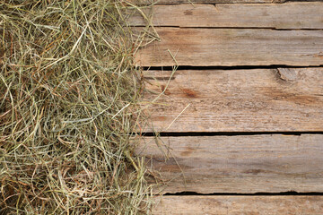 Dried hay on wooden table, top view. Space for text