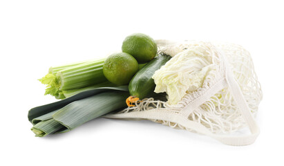 String bag with different vegetables isolated on white