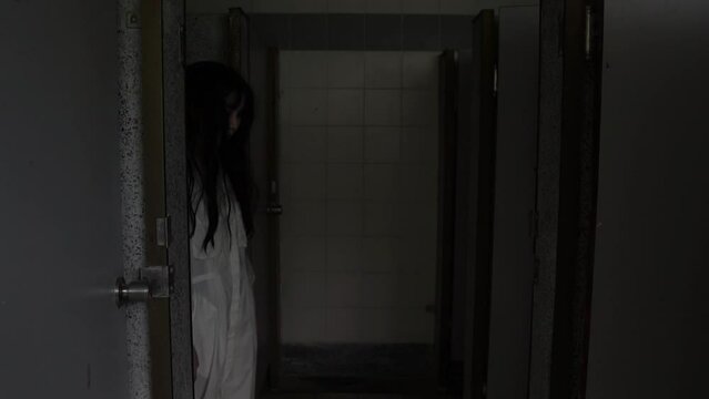 A ghostly woman roams the decayed halls of an abandoned house, her pale figure flickering in the dim moonlight, trapped between worlds, forever searching for vengeance on a cold Halloween night