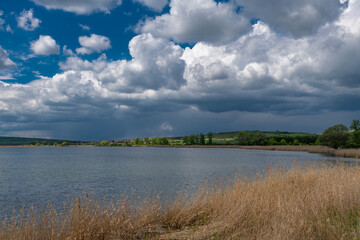Lookout tower near Nesyt pond in cloudy spring day in south Moravia